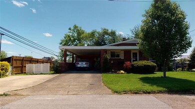 Front Street View with driveway and extra parking