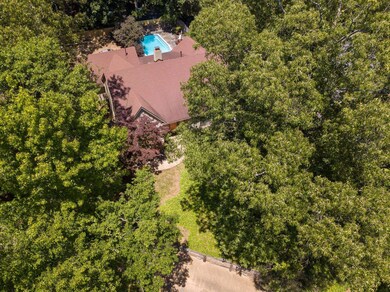 Nestled among mature trees and lush landscaping, this Summer will be so much more fun with this pool!