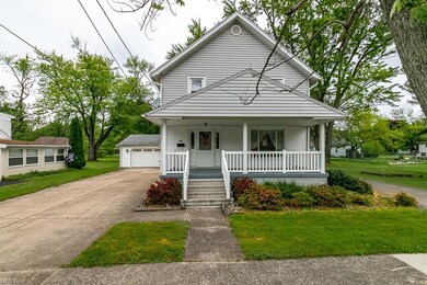 Located on a triple lot with multiple driveways, t