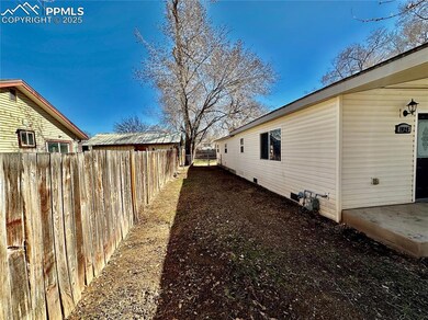 View of property exterior with crawl space and fen