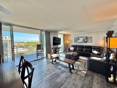 Living room featuring dark wood-style flooring and