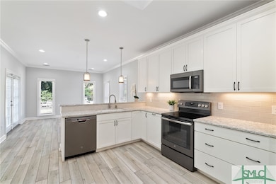 Kitchen w/Stainless Steel Appliances, White Shaker