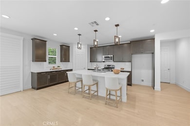 Bright and open kitchen seamlessly connected to the living area for easy entertaining.