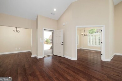 Entry/Foyer area. Gorgeous hardwoods.  Plantation shutters are throughout the home.