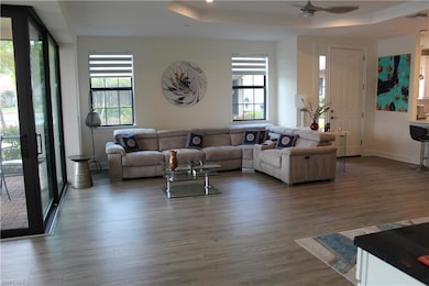 Living room featuring visible vents, baseboards, c