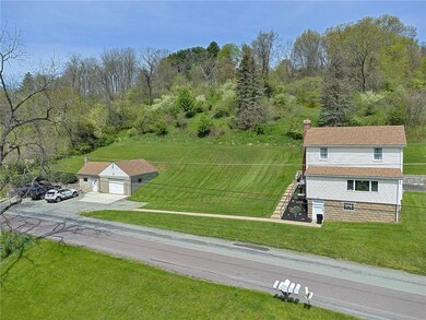 View of front of home with garage to left.
