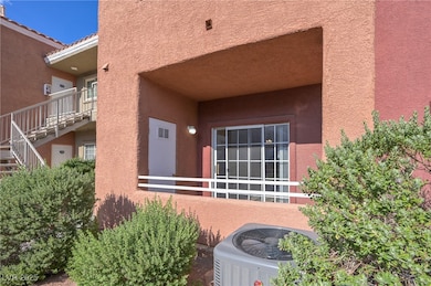View of exterior entry with stucco siding