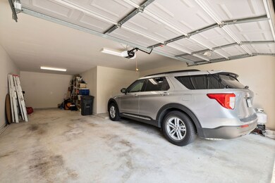 Sneak-peak to the 3-car-tandem garage. Current owners have 2 mid-size SUVs that fit side-by-side, PLUS the 3rd bay tandem for storage in the rear.