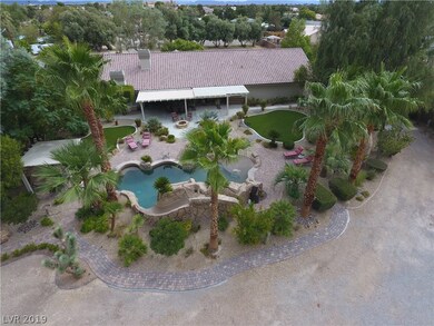 Back pool area and back of house.   Pool has slide