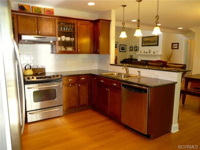 Kitchen with stainless appliances, bamboo floors a