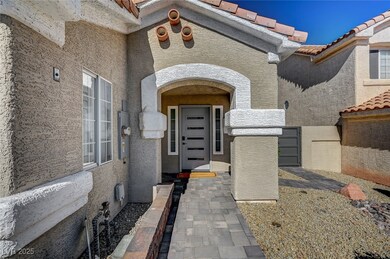 Doorway to property featuring stucco siding and a