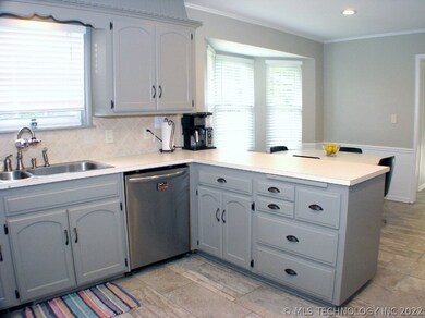 Freshly painted cabinets in trendy grey and a new