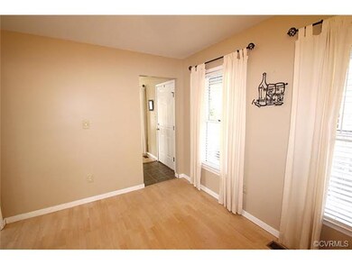 Dining area features laminate floors and tons of n