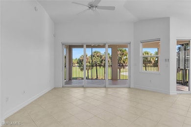 Spare room with light tile patterned floors and ceiling fan
