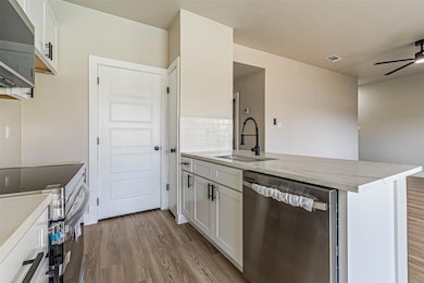 Kitchen featuring a sink, stainless steel applianc