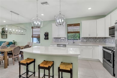 Kitchen featuring light countertops, a center isla