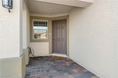 Doorway to property with stucco siding