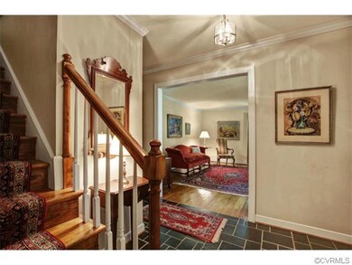 Foyer with Slate Flooring and Crown Molding.