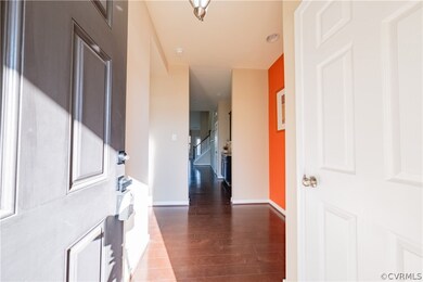 Entrance foyer featuring dark hardwood / wood-styl