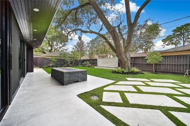 Beautiful backyard upgrades include fire pit, wate