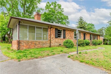 Single story home featuring a front lawn