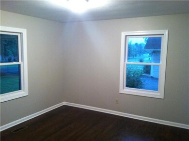 One of three bedrooms. Refinished hardwoods in all three!
