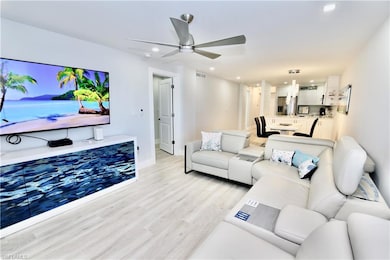 Living area with visible vents, baseboards, ceilin