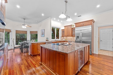 Kitchen featuring wine cooler, a healthy amount o