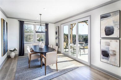 Dining area featuring crown molding, light wood-st