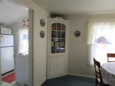 View of kitchen and dining area with built-ins