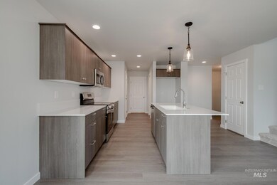 Kitchen with appliances with stainless steel finishes, modern cabinets, light wood-style flooring, and recessed lighting