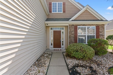 Entrance to property featuring stone siding and a 