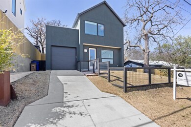 Contemporary home featuring concrete driveway, a 