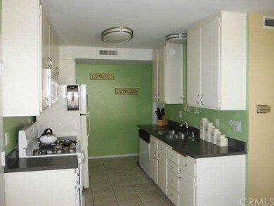 Large kitchen features ample cupboard space, gas s