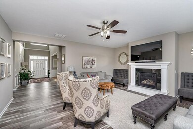 Large 2 story foyer w/wide hall leads to family room w/fireplace.  The neutral colors of paint and flooring make this home warm, welcoming, and move in ready!
