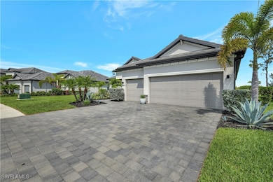 View of home's exterior with decorative driveway,