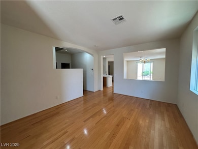 Spare room with light wood-style flooring, arched