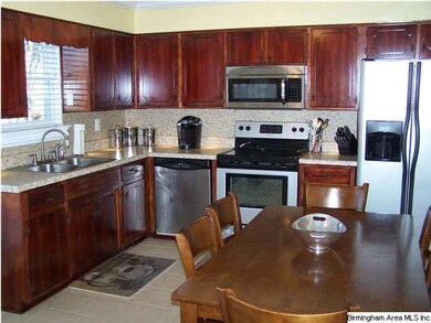 Large kitchen with stainless appliances