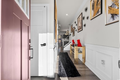 Corridor featuring dark hardwood / wood-style floo