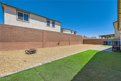 View of yard featuring a patio and a fire pit