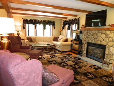 Spacious living area with hardwood...