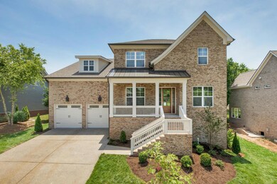 This all brick home has a 3 car tandem garage.