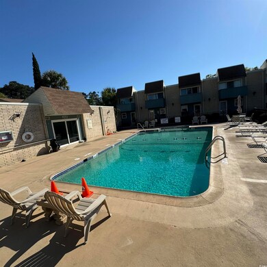 Community pool with a patio area