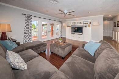 Fabulous living room overlooks the water and featu