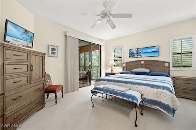 Bedroom with light carpet, ceiling fan, and access