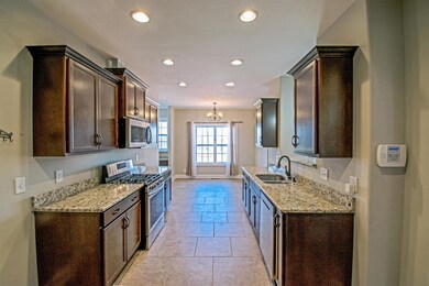 View of Kitchen with Tile Flooring and Granite Counter Top’s 