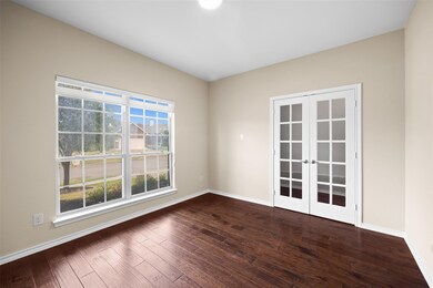 Unfurnished room with dark wood-type flooring and 