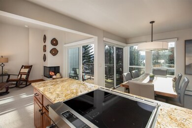 Updated Kitchen open to Living Area and Dining Area with Large Windows and Sliders