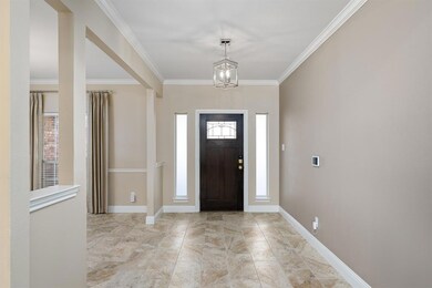 Entry way features glass in laid door.