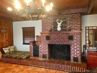 brick fireplace with a cozy nook beside it